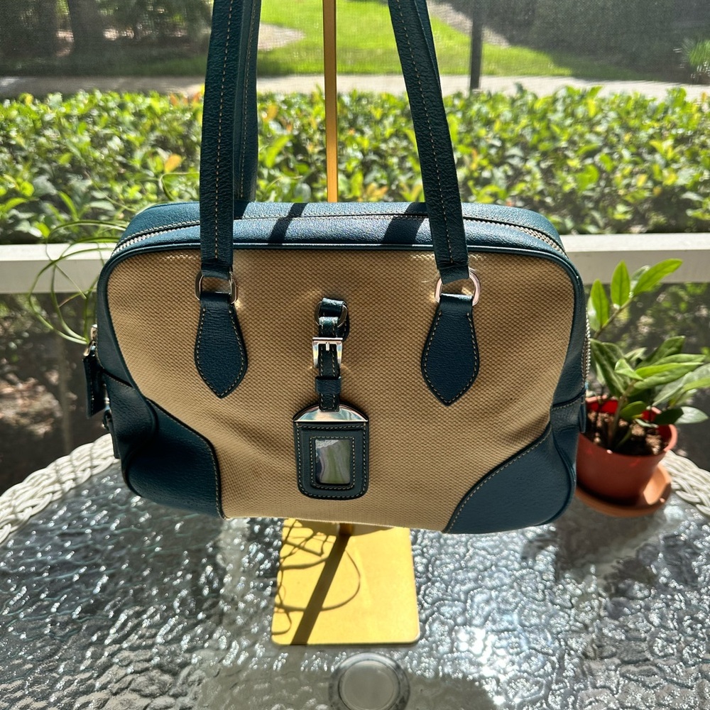 Prada bag leather and canvas bag with lock and key.  Authenticated by Posh